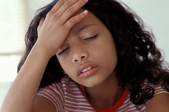 Young girl with a headache