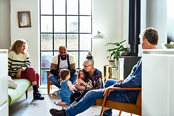 Grandparents playing with grandchildren while parents watch