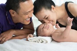 Picture of happy parents with their newborn baby