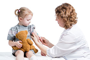 A little girl getting a vaccine.