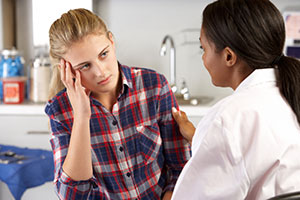 Teen talking to doctor